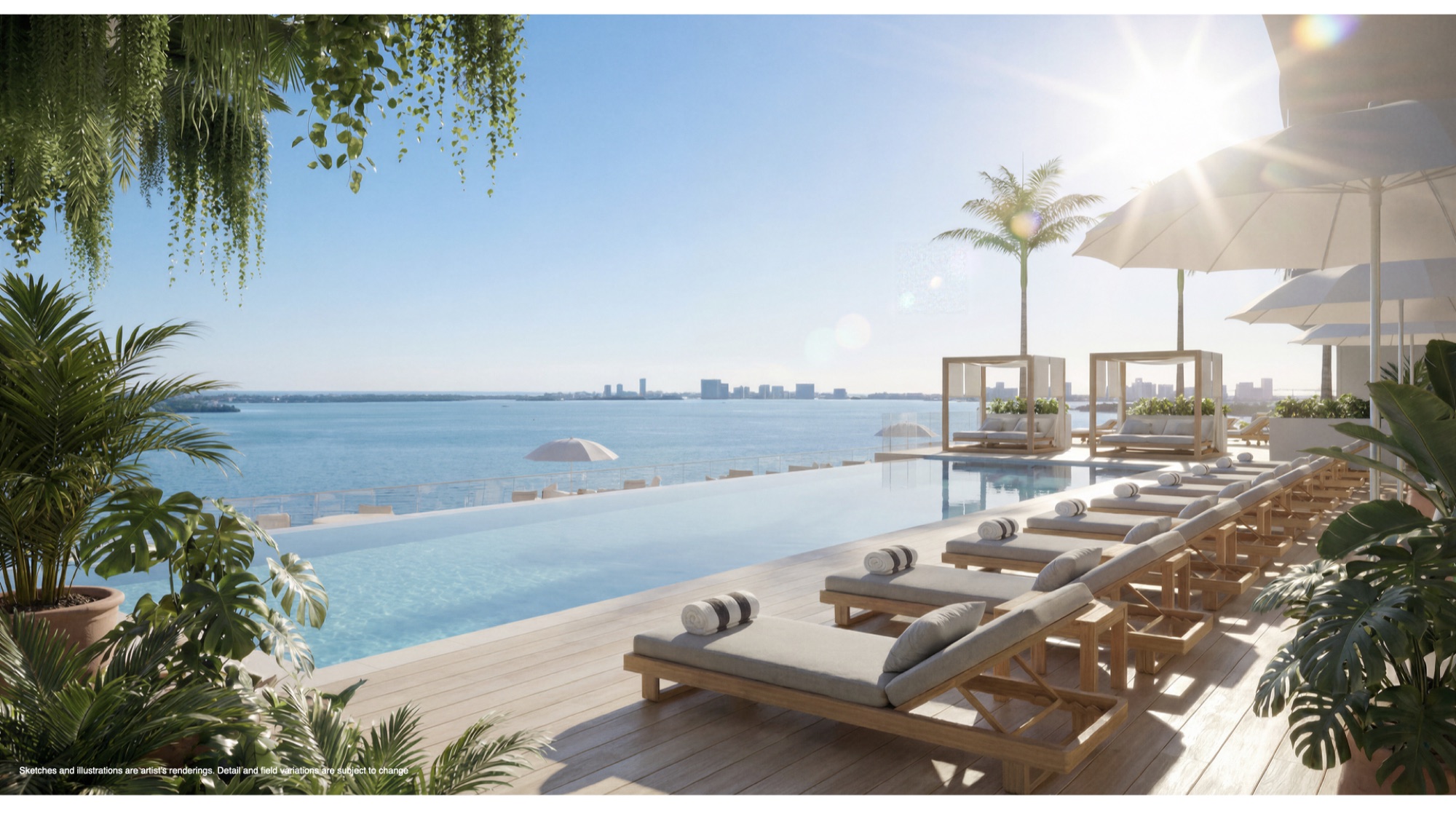 The Mermaid Club saltwater pool at Continuum 12000 — a bayfront pool with private cabanas and daybeds overlooking Biscayne Bay, with the Miami skyline beyond.