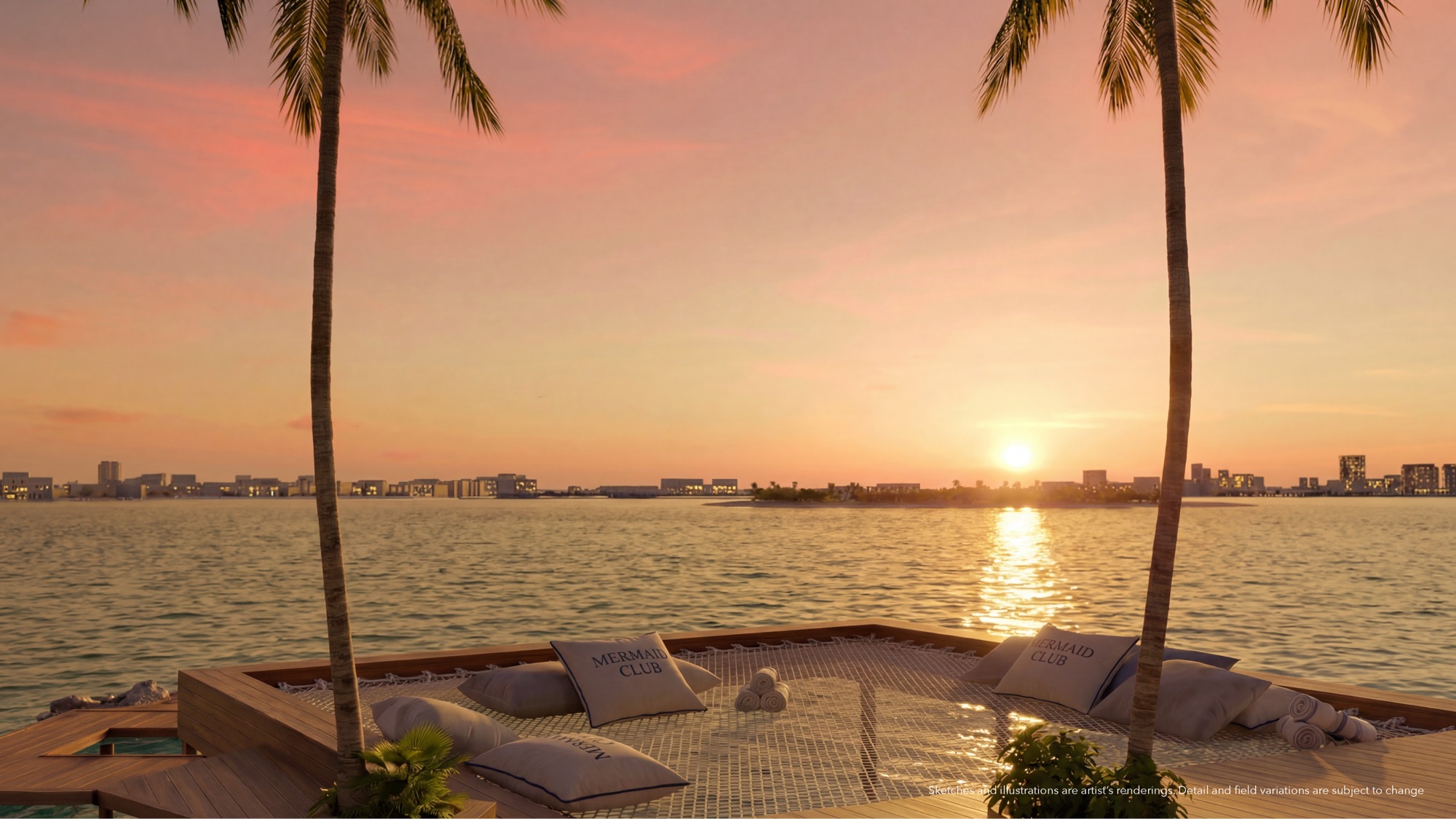 Sunset over the Continuum 12000 waterfront — daybeds and sun loungers along the bay's edge at golden hour, with the Biscayne Bay aquatic preserve beyond.